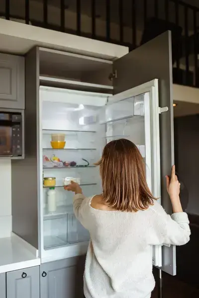 Customer using a home refrigerator