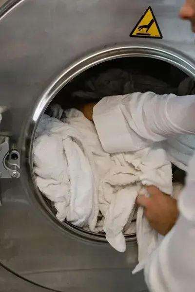 Loading towels into a washing machine
