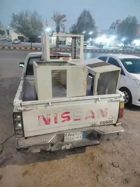Service vehicle loaded with AC units in Riyadh